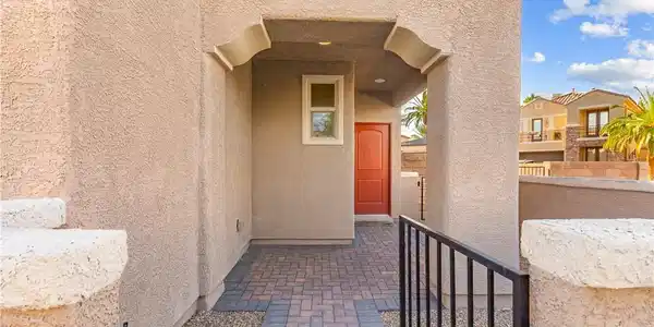 Image 4: An inviting entryway with a decorative archway and