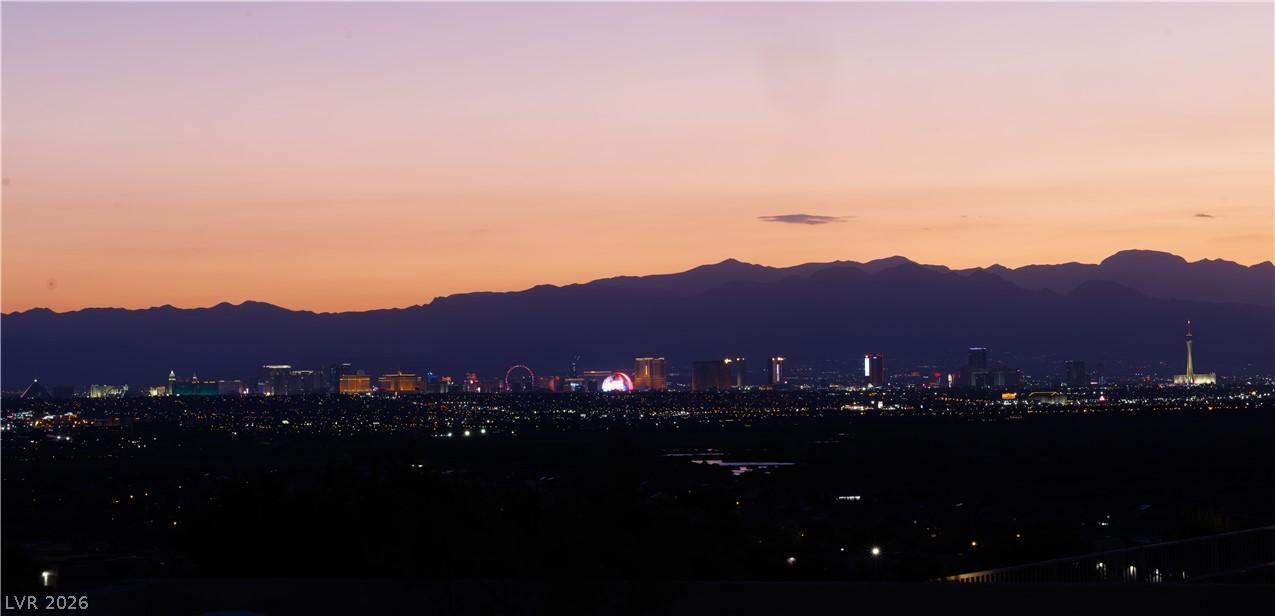 Image 2: Dramatic mountain and city views unfold under a br