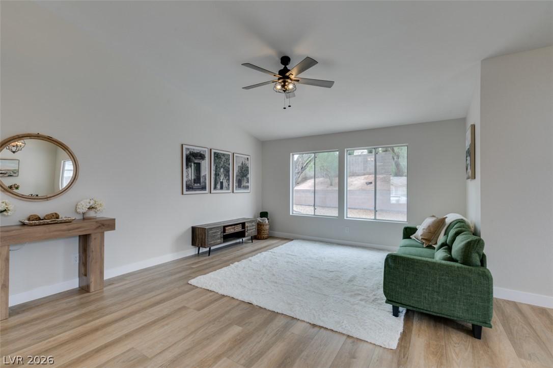 Image 2: Natural light floods this inviting living space, h