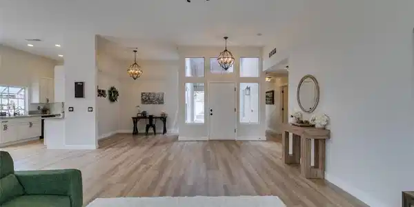 Image 4: Natural light floods this inviting living space, s