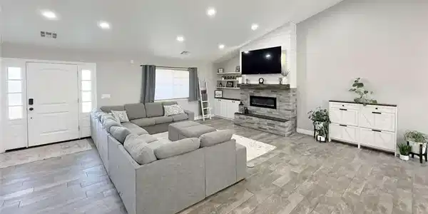Image 2: Recessed lighting illuminates this inviting living