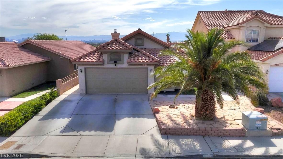 Image 1: A well-maintained suburban residence offers a conc