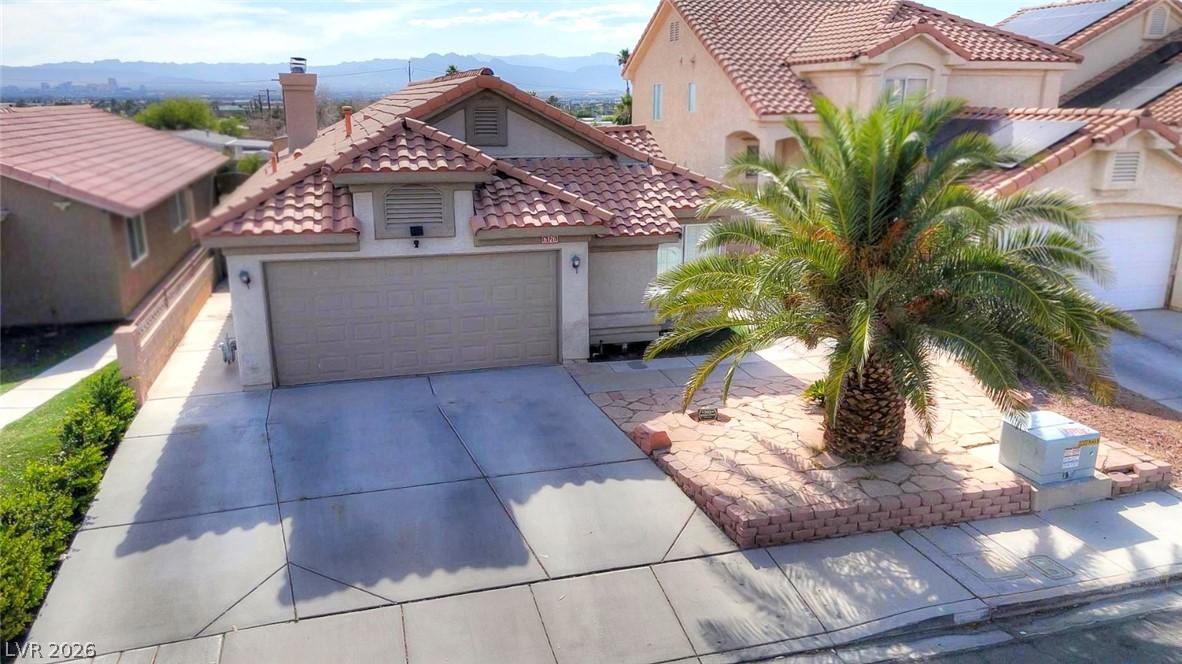 Image 4: A well-maintained facade features a double garage