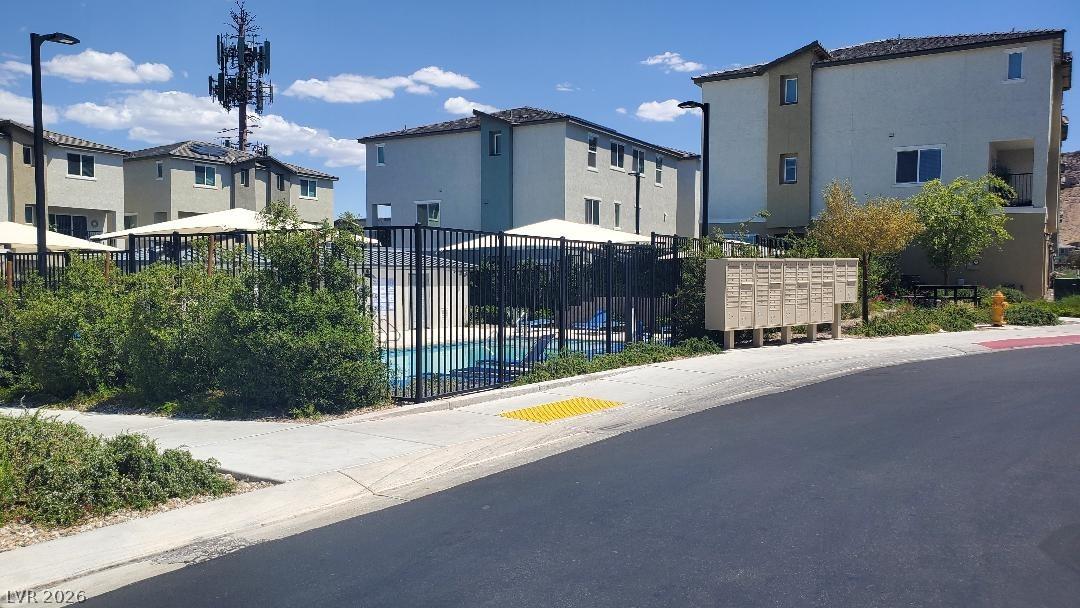 Image 2: Community pool area and residential structures awa