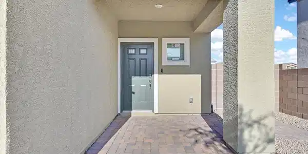 Image 2: A welcoming entry featuring paver flooring and a c