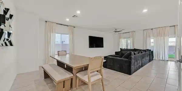 Image 4: A spacious, open-concept living area with abundant