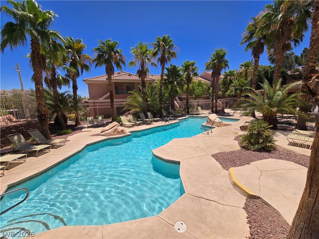 Image 2: An oasis of refreshing water surrounded by lush pa