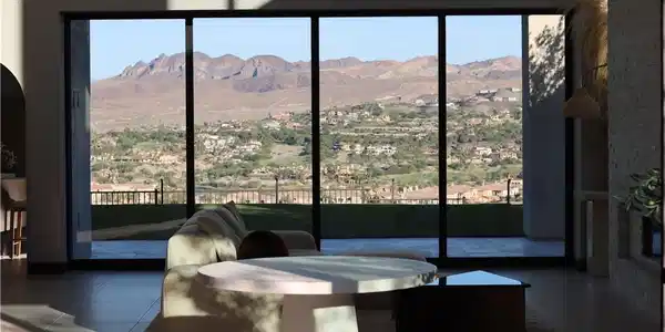 Image 3: Floor-to-ceiling windows frame sweeping mountain a