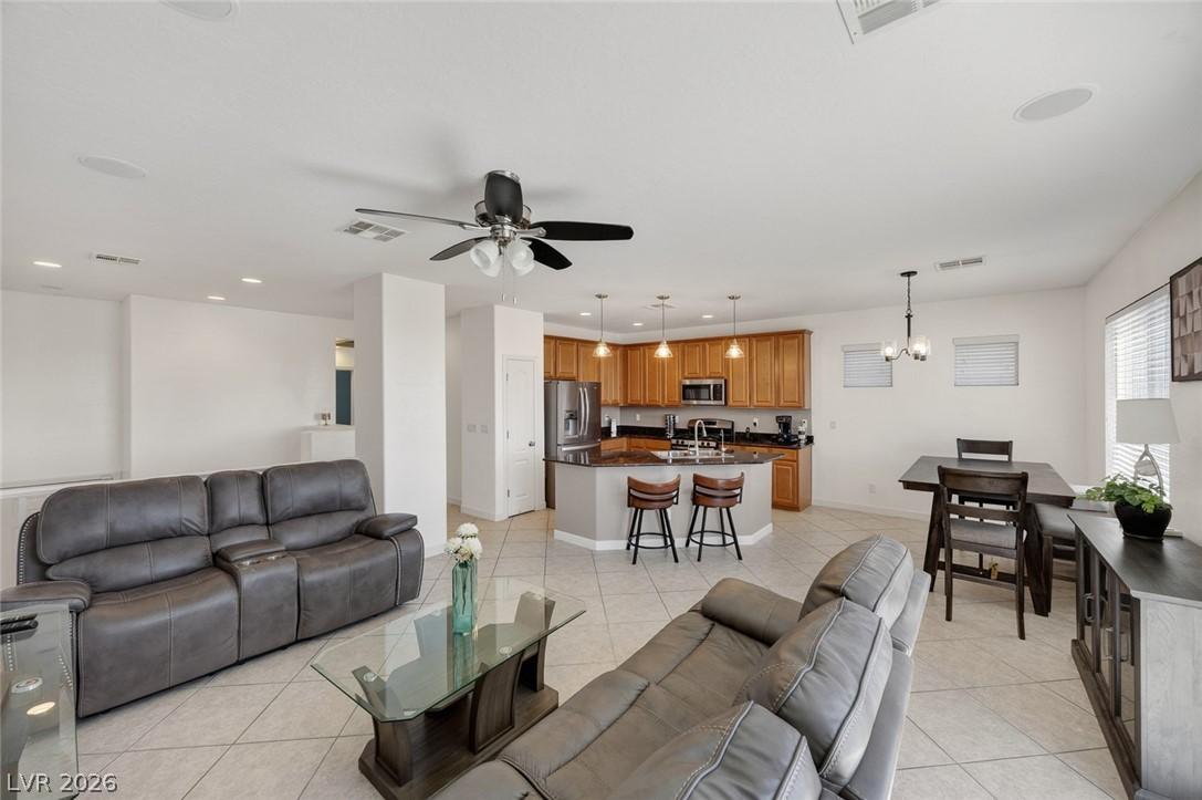 Image 2: This bright living area features an open floor pla