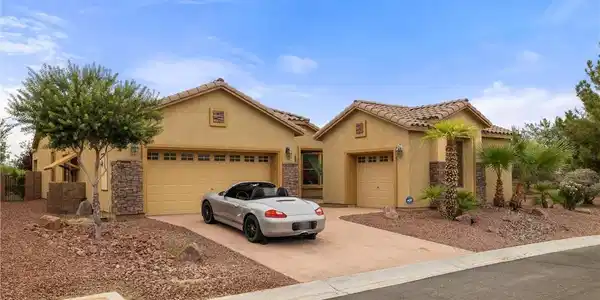 Image 2: This desert oasis features a multi-car garage and