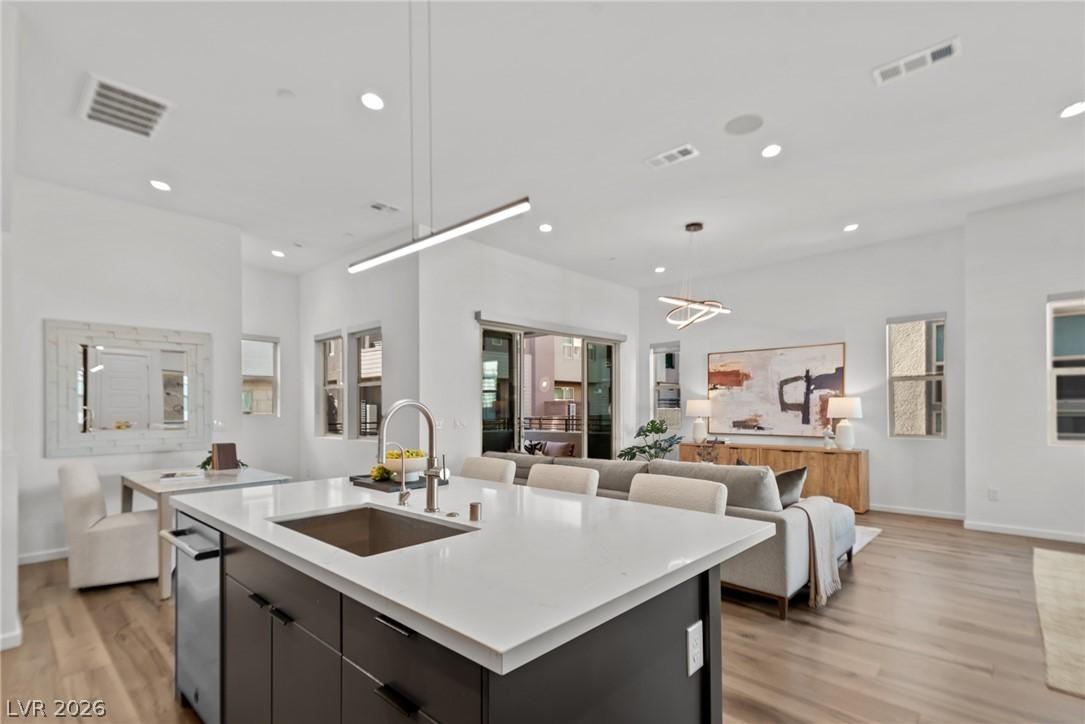 Image 2: An open-concept living space integrates a well-app