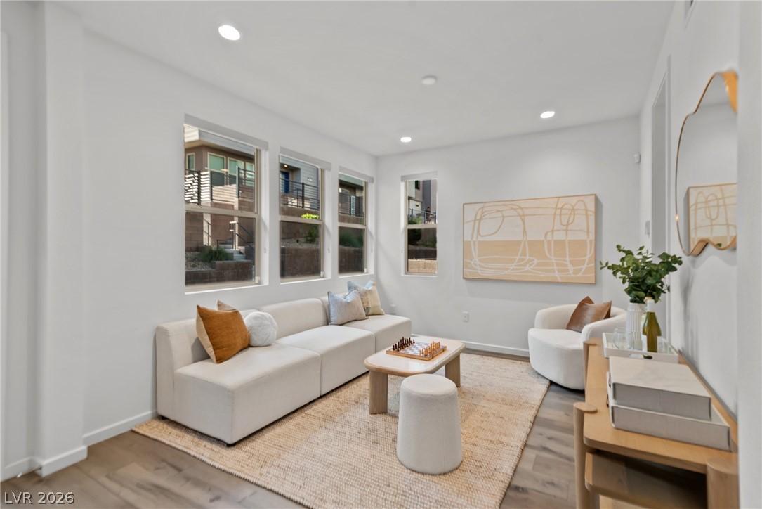 Image 4: Natural light floods this inviting living space, h