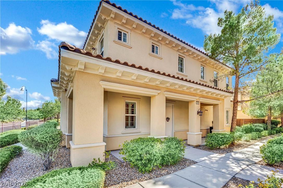 Image 2: A well-maintained stucco exterior with Mediterrane