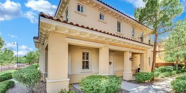 Image 2: A well-maintained stucco exterior with Mediterrane