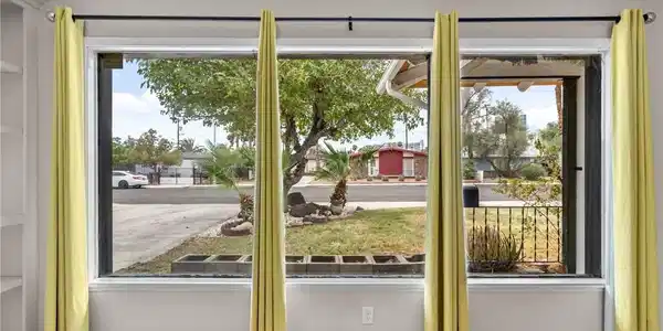 Image 3: Large picture windows frame neighborhood views, il