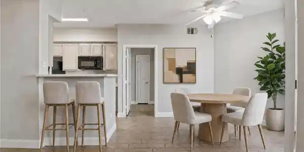 Image 3: **Virtually Staged** An inviting eat-in kitchen wi