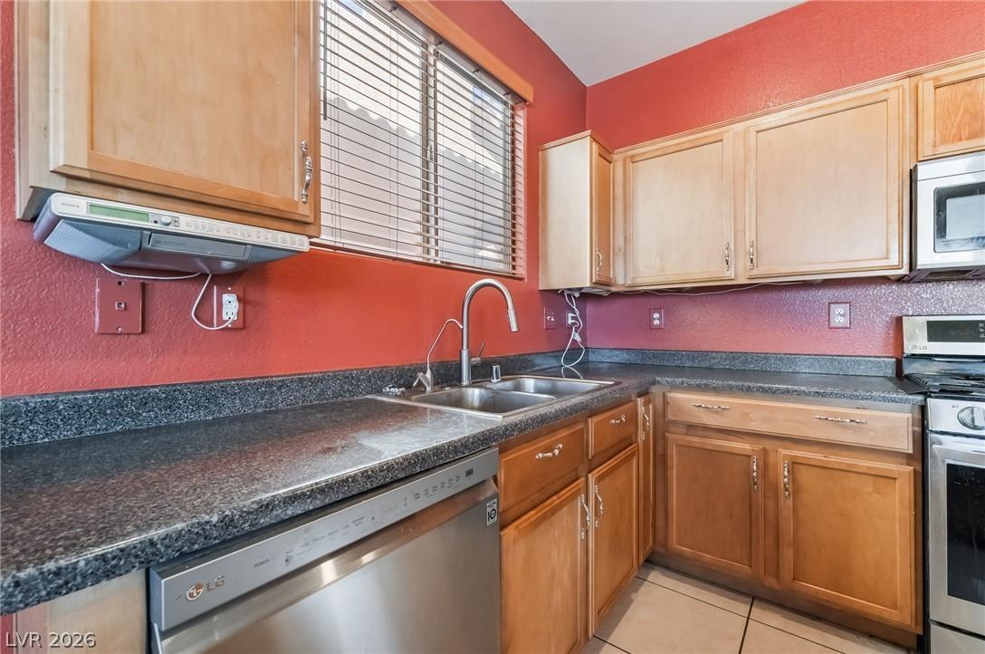 Image 3: A well-appointed kitchen showcasing durable counte