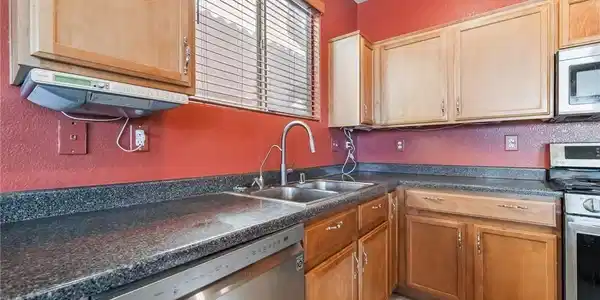 Image 3: A well-appointed kitchen showcasing durable counte