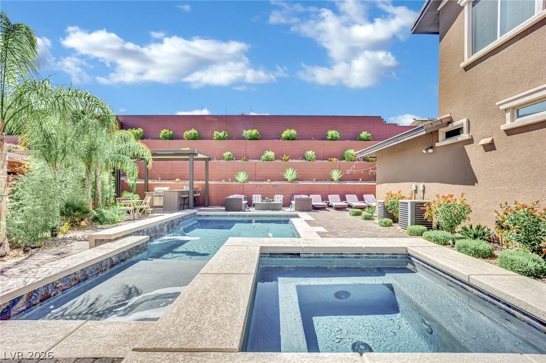 Image 2: An inviting backyard oasis awaits with a sparkling