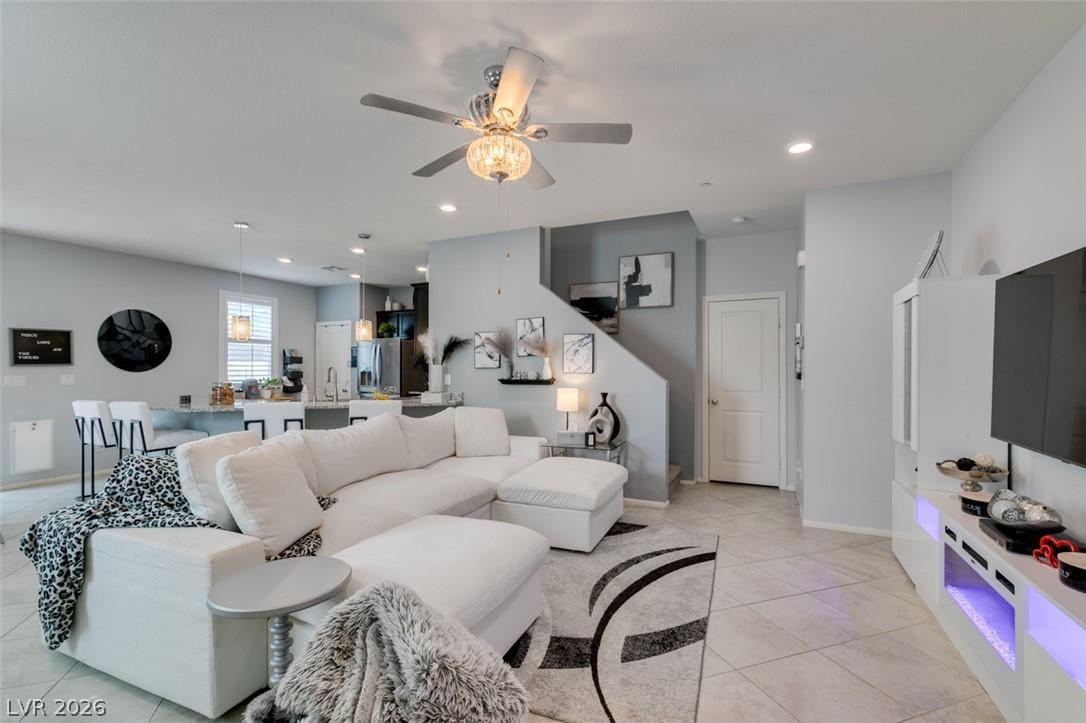 Image 3: A well-lit, open-concept living area boasts sleek