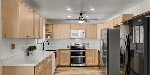 Image 3: Gleaming wood flooring pairs perfectly with clean
