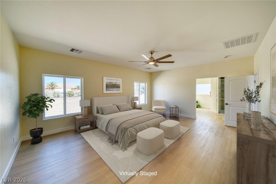 Image 3: Virtually staged primary bedroom with vaulted ceil