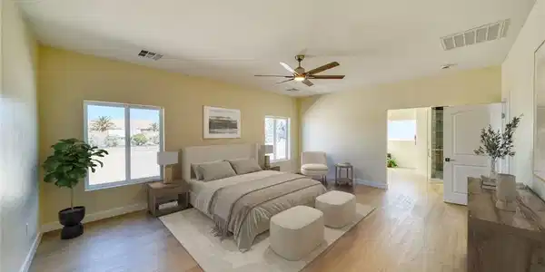 Image 3: Virtually staged primary bedroom with vaulted ceil