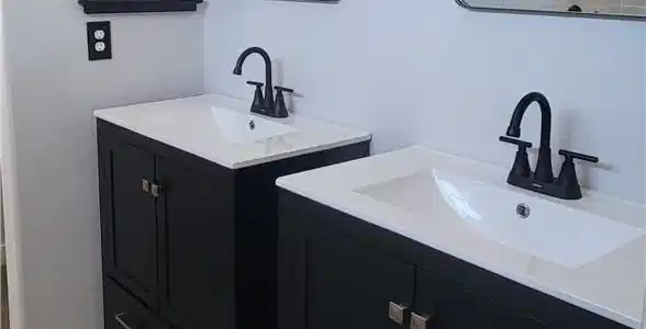 Image 4: Dual vanities with matte black hardware and white