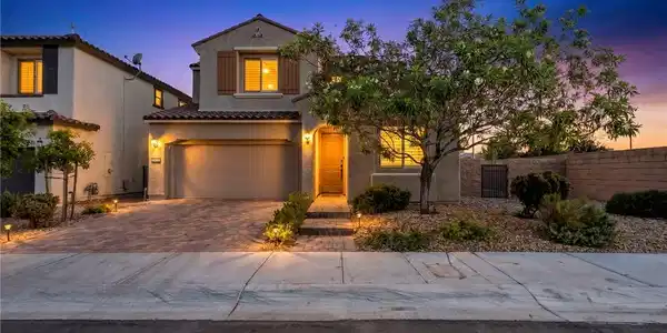 Image 2: Illuminated entryway welcomes you to this captivat