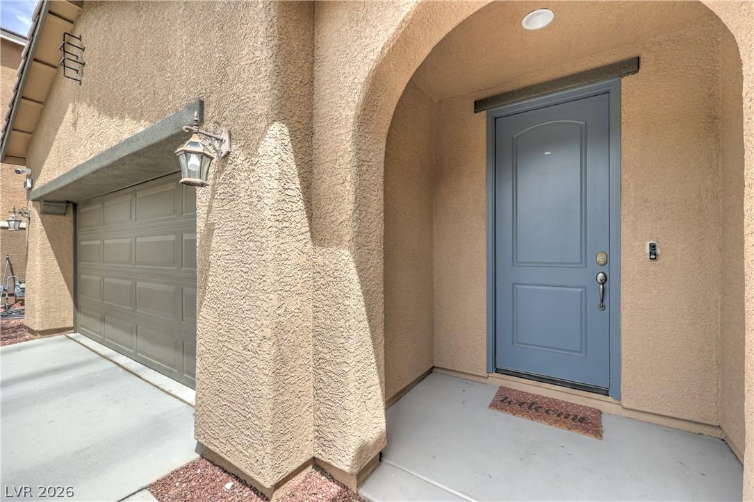 Image 4: An inviting entry showcases a recessed light and a
