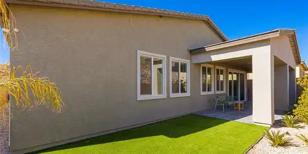 Image 2: A private outdoor space features a covered patio a