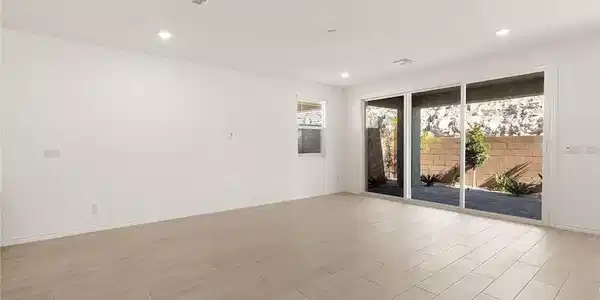 Image 4: Sliding glass doors open to a private outdoor spac