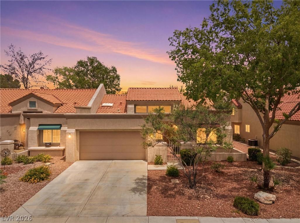 Image 3: An inviting exterior with a clay tile roof, attach