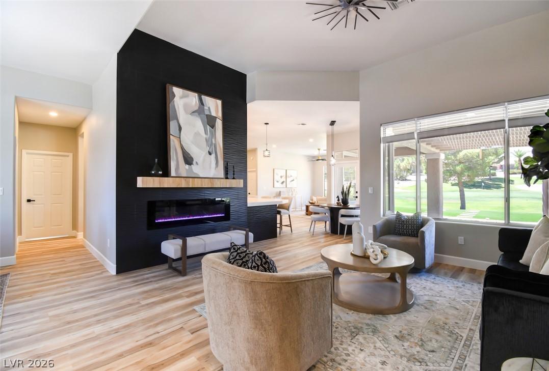 Image 1: Elegant living area features an electric fireplace