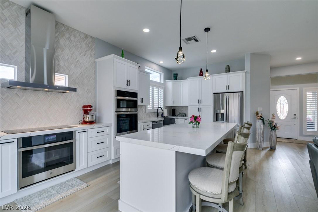 Image 4: Culinary delights await in this bright kitchen wit