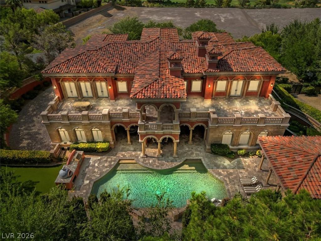 Image 3: Rear view of house with a patio area, an outdoor p