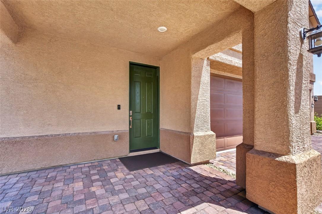 Image 4: A welcoming front entrance featuring a green door