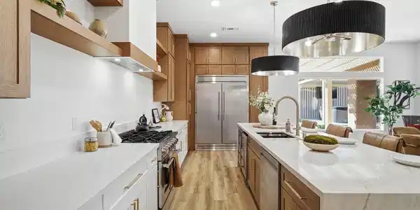 Image 4: Culinary delights await in this bright kitchen, sh
