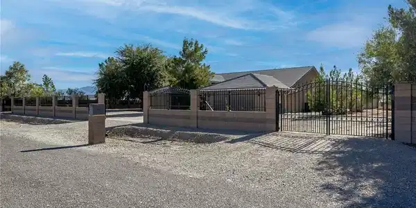 Image 3: A welcoming facade with a spacious garage and ampl
