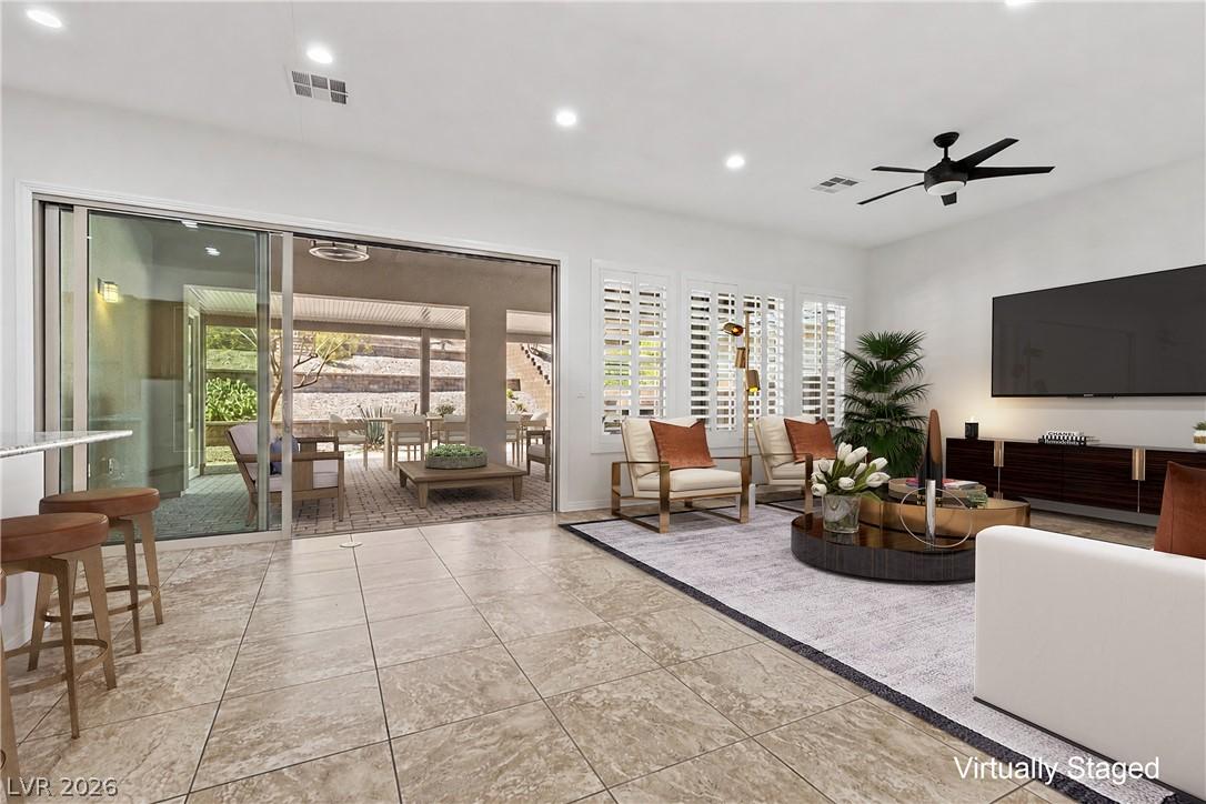Image 4: Sliding glass doors open to an inviting outdoor li