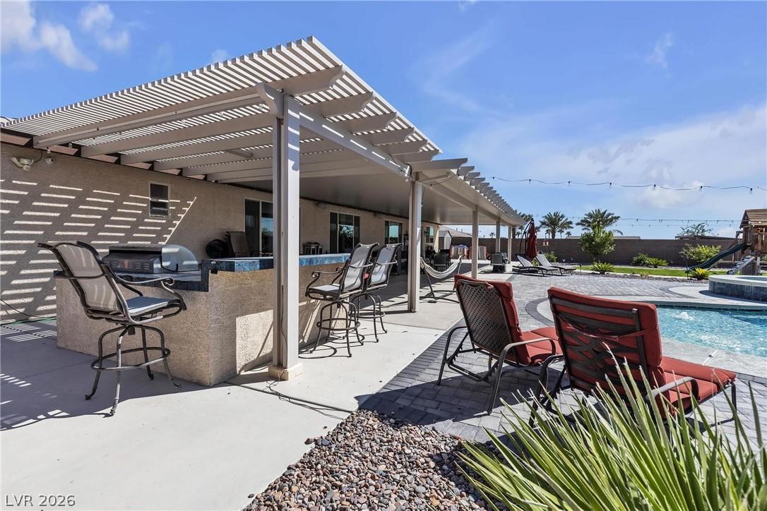 Image 4: Covered Patio with Built in Grill