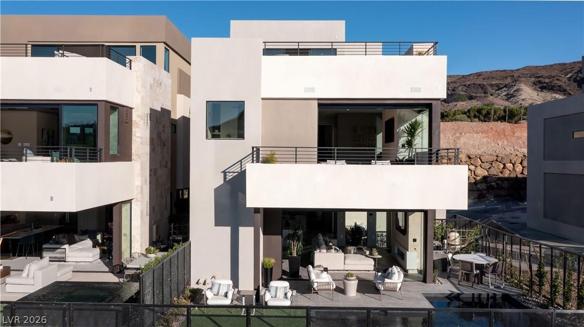 Image 2: A striking modern facade integrates multiple balco