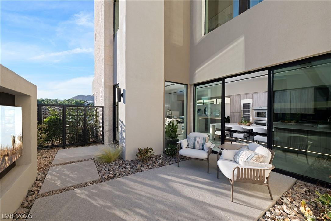 Image 3: An inviting outdoor patio features comfortable sea