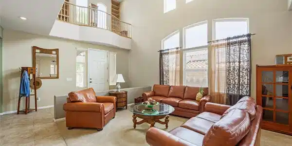 Image 4: A lofty living room features a dramatic two-story