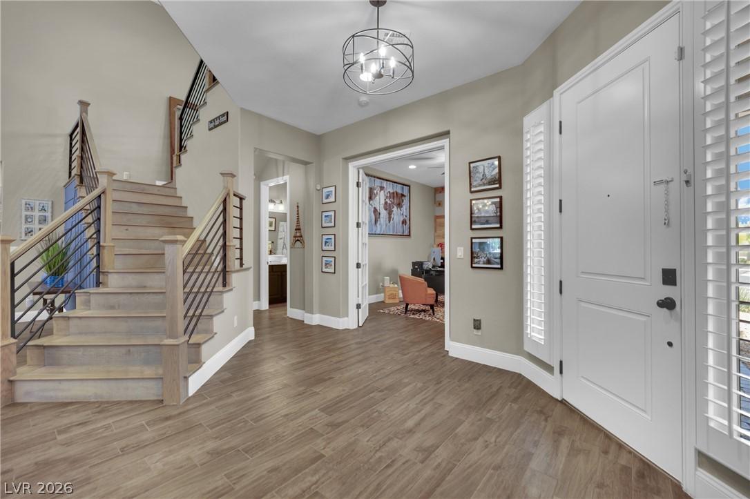 Image 4: A welcoming entryway with wood-look tile flooring