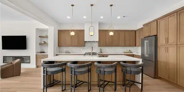 Image 2: A contemporary kitchen offers an inviting island w