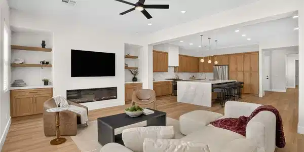 Image 3: An open-concept living space integrates a cozy sea