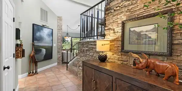 Image 4: Enter this inviting foyer, featuring architectural