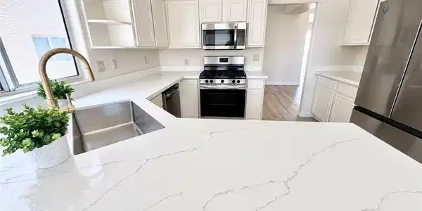 Image 2: Polished stone counters and matching cabinetry def