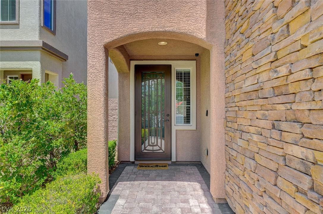 Image 4: The home welcomes guests with a decorative securit